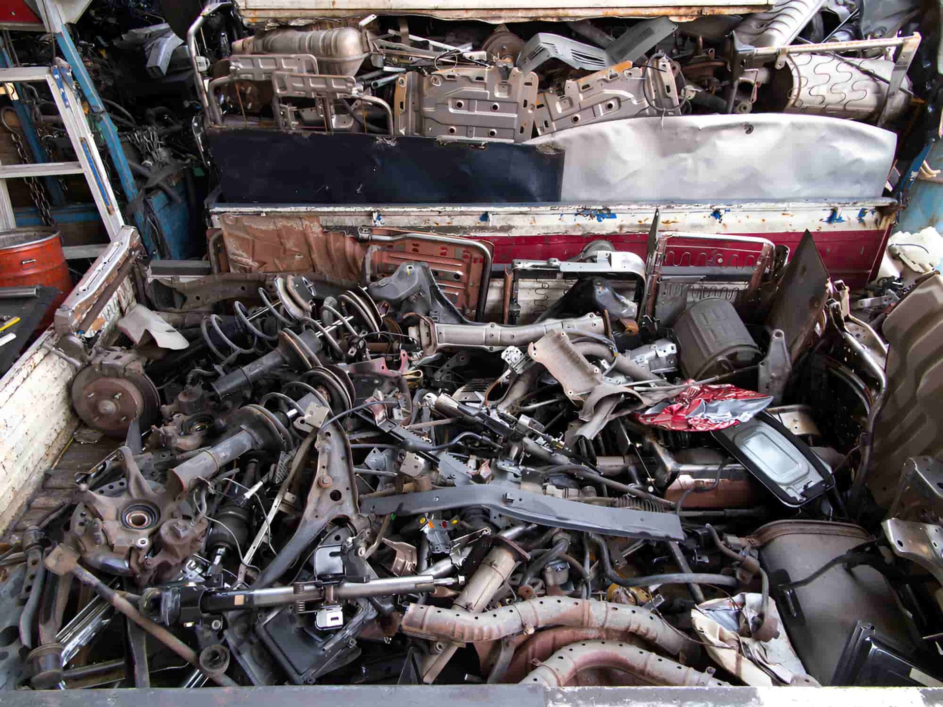 A Pile Of Scrap Metal Is Sitting On Top Of A Table — North Queensland Recycling Agents In Bungalow, QLD