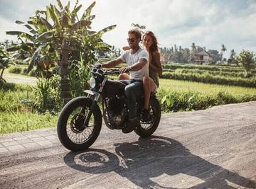 Couple riding a motorcycle — Auto Insurance in Naples, FL
