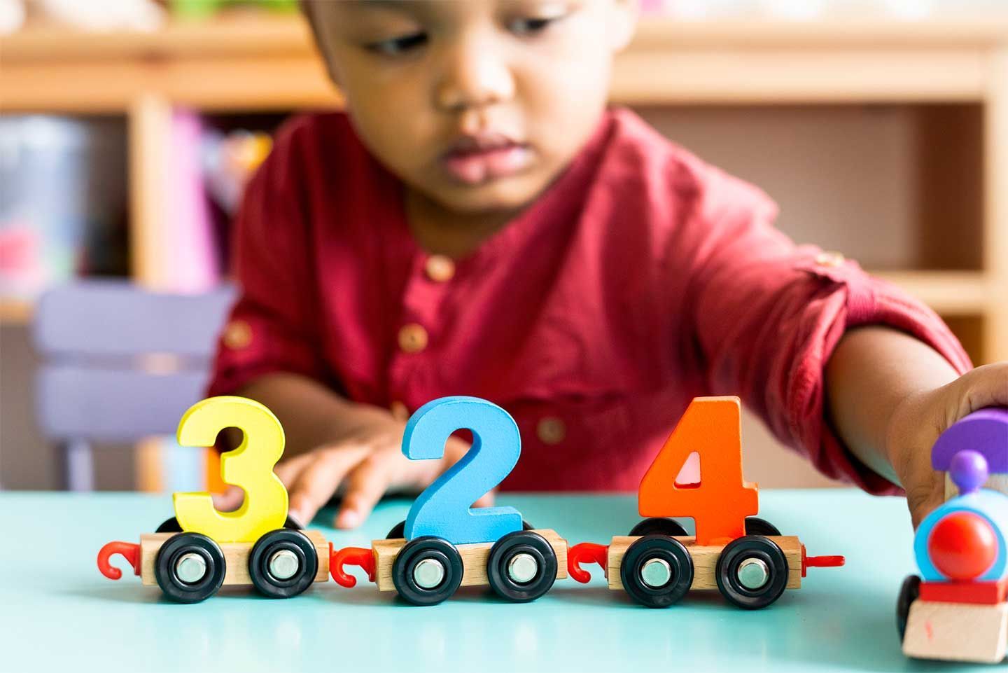 Boy playing with Trains
