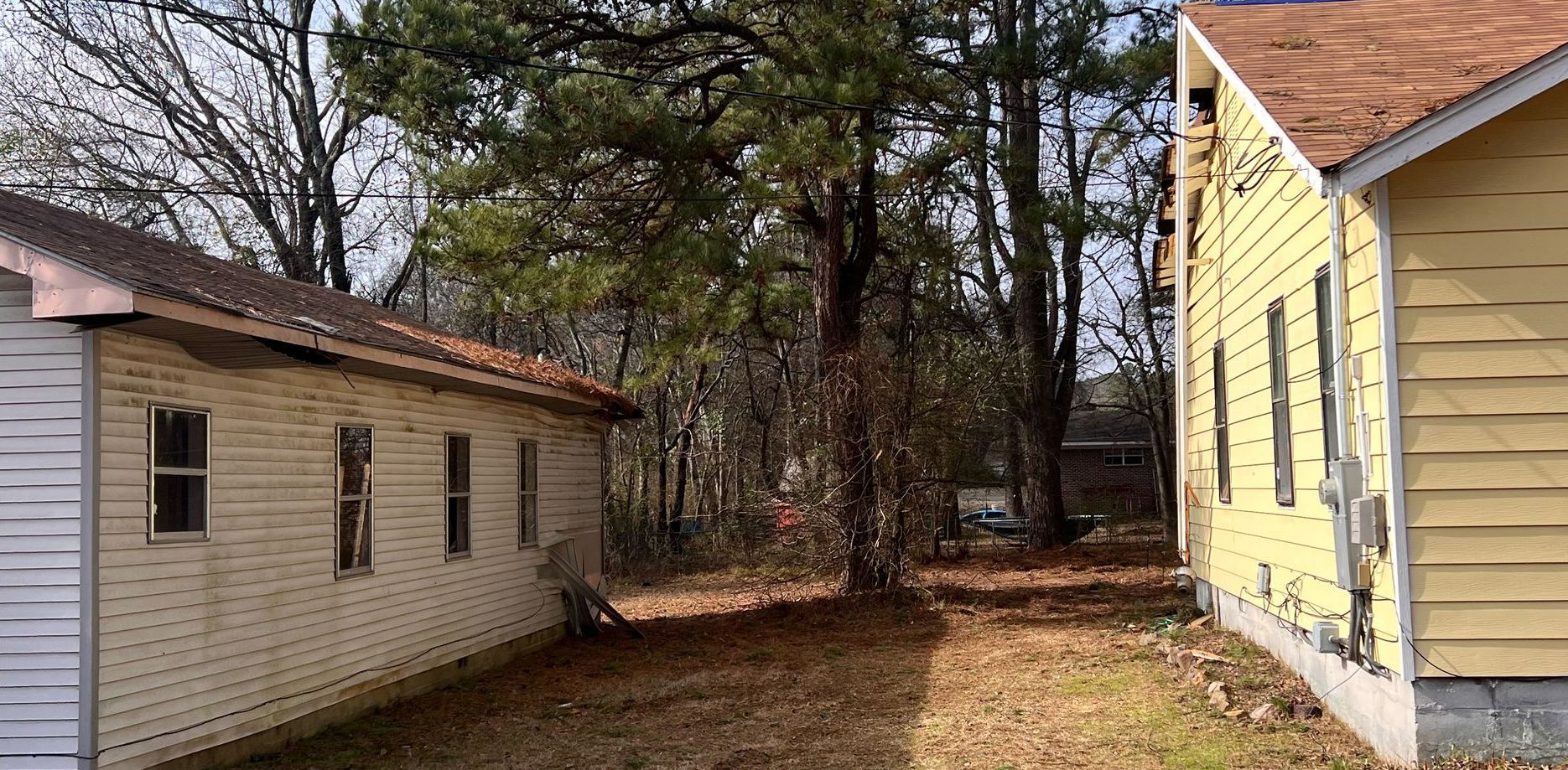 A couple of houses sitting next to each other in a residential area.