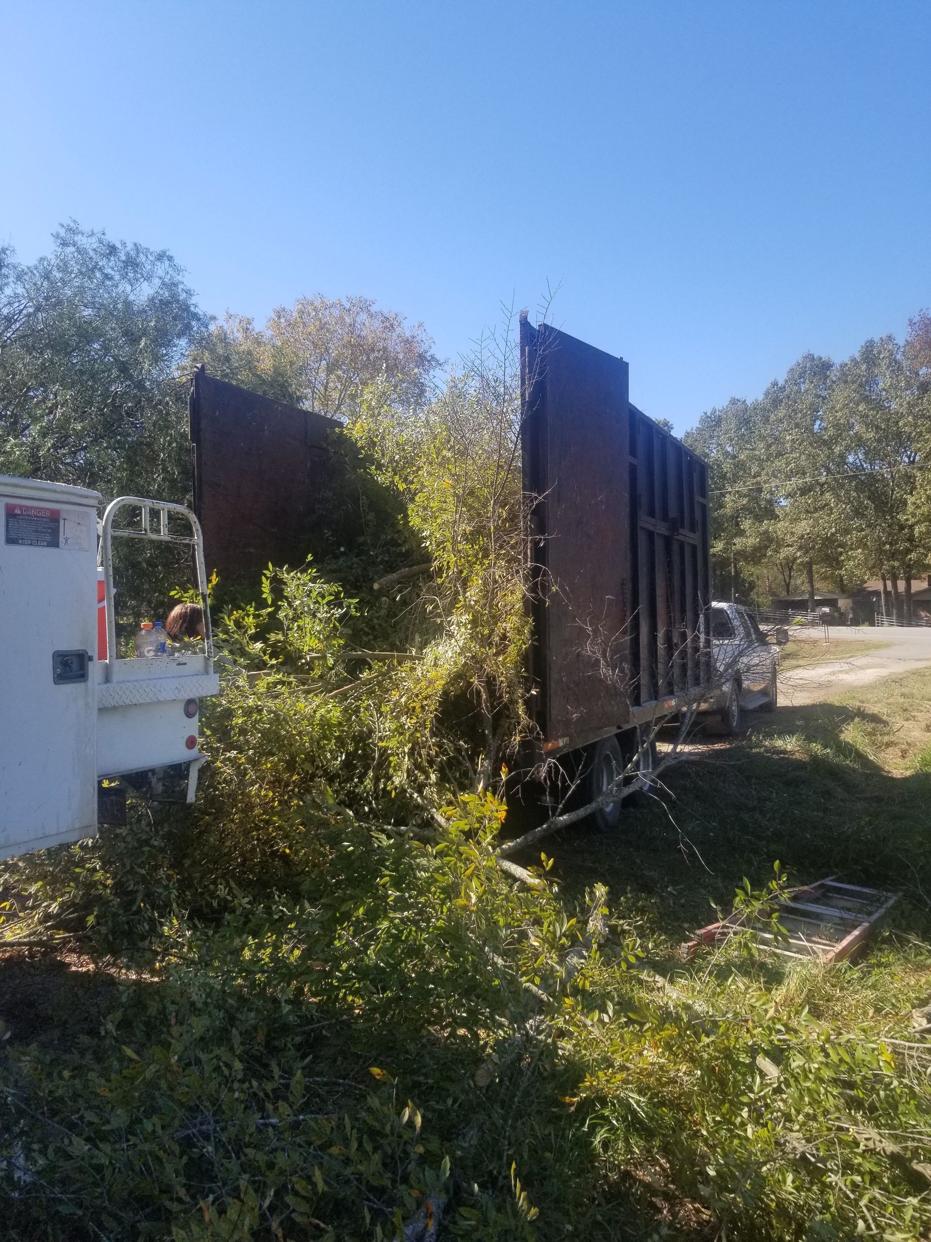 A truck is sitting in the middle of a grassy field.