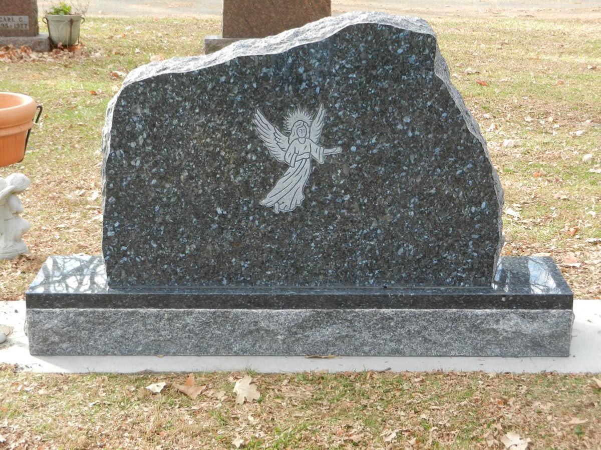 Gravestone With Angel Sign