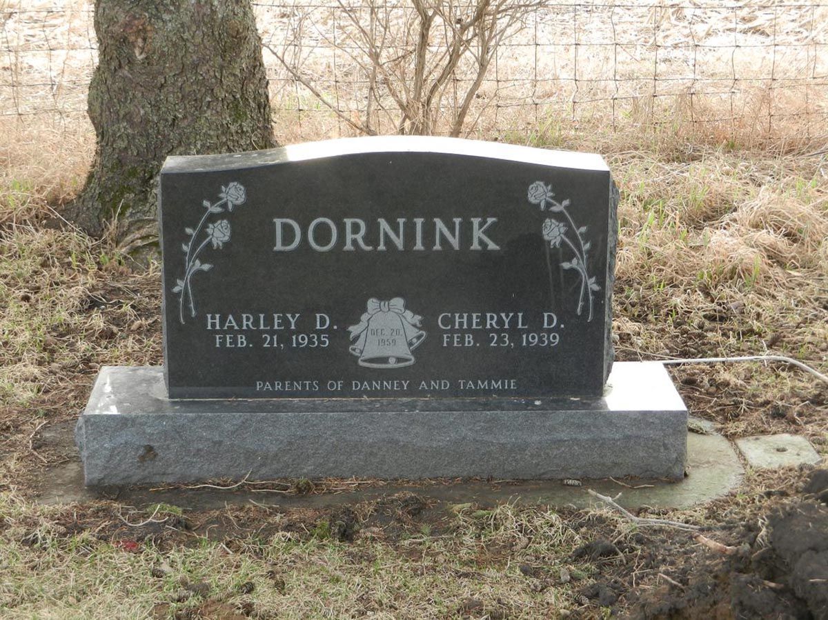 A black gravestone with the name dornink on it