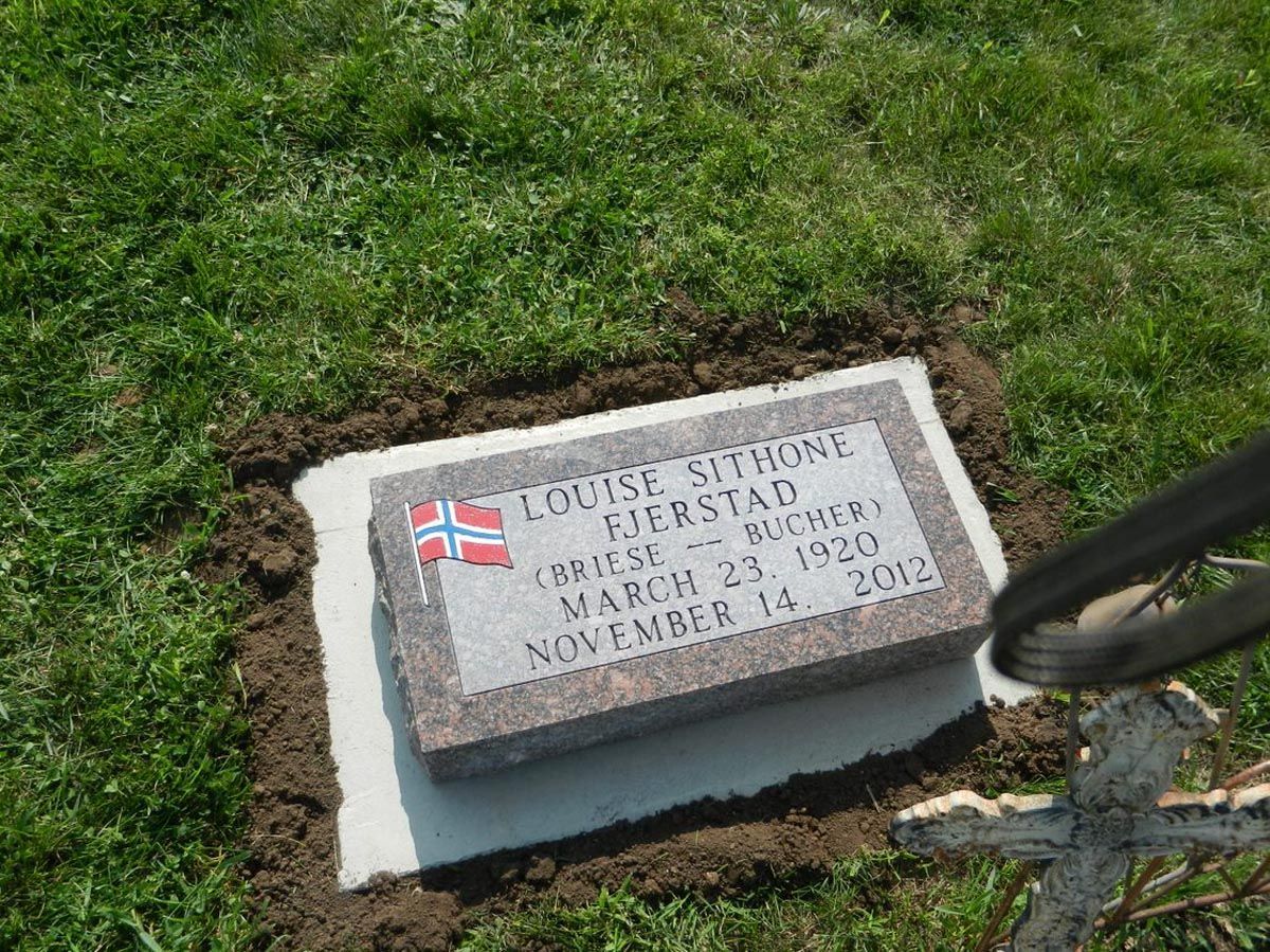 A gravestone with the name louise on it
