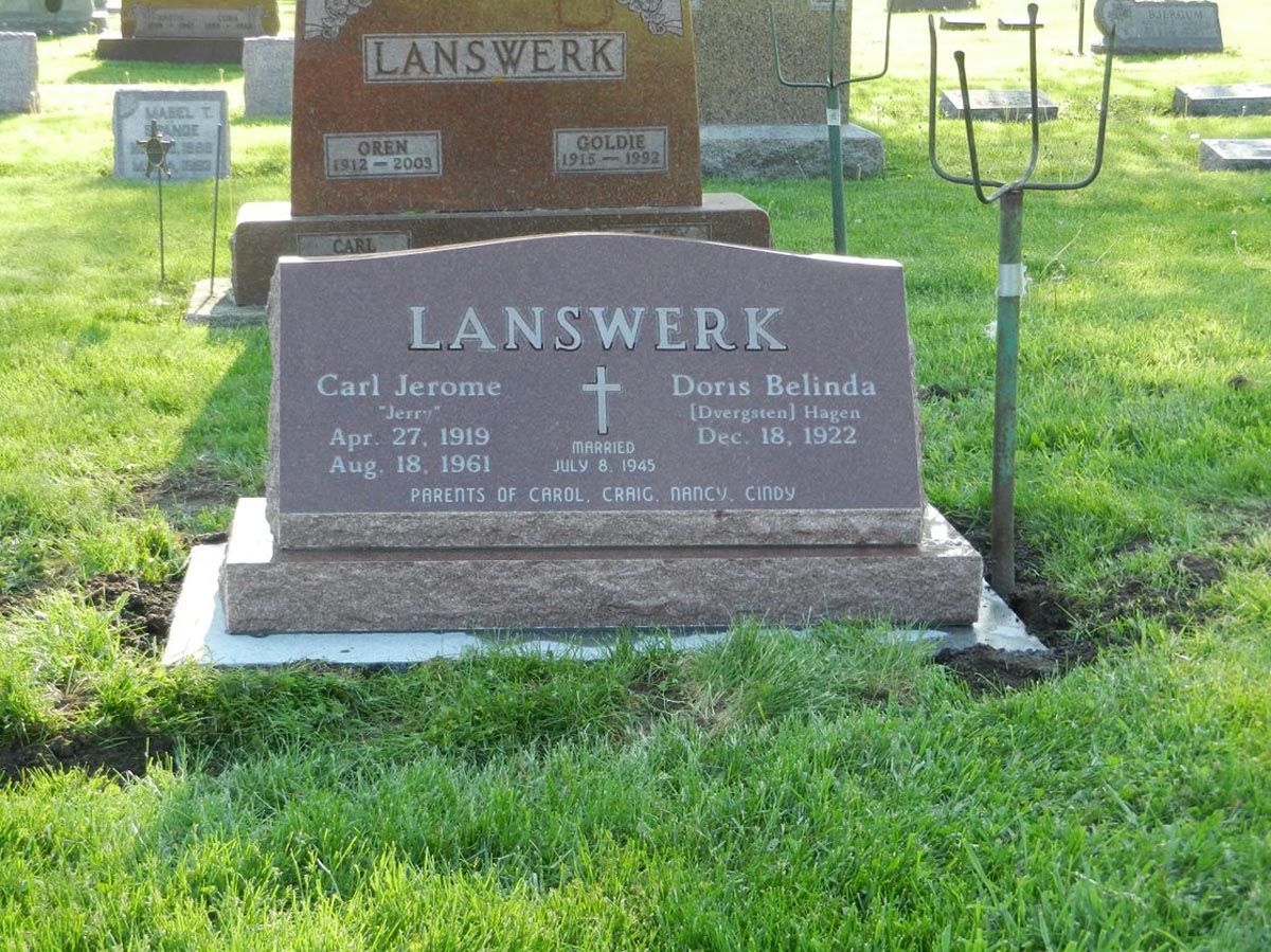 A gravestone in a cemetery with the name lanswerk on it