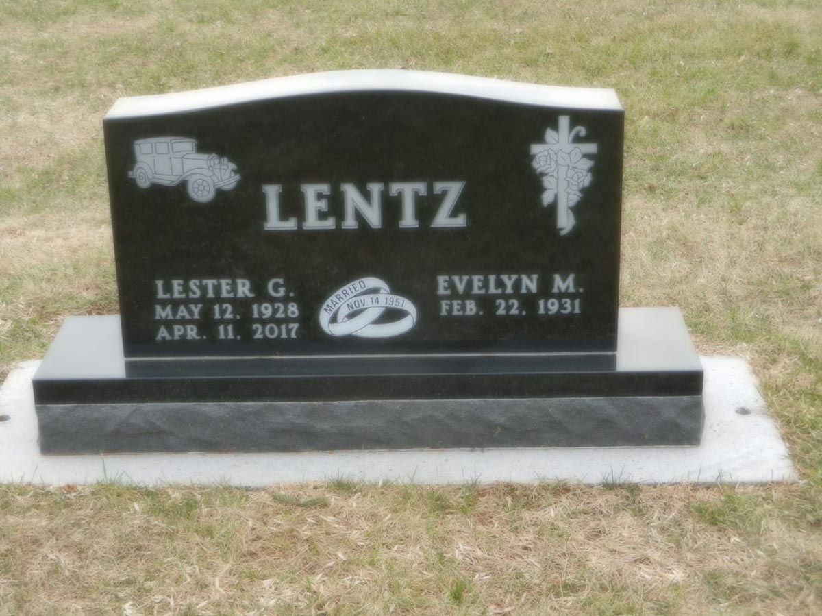 A black gravestone with the name lentz on it