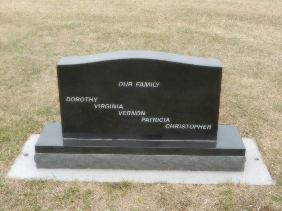 A black gravestone with the name dorothy virginia vernon patricia and christopher on it