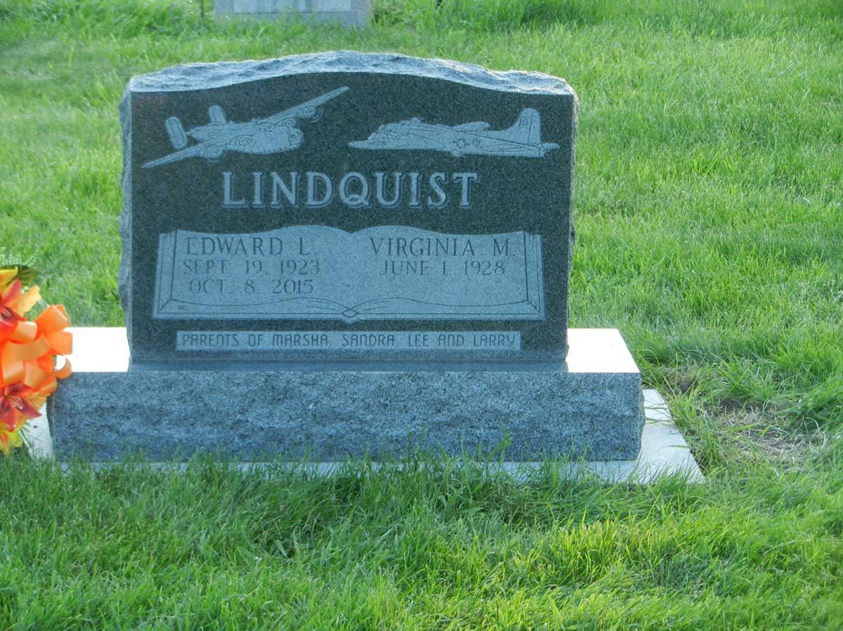 A gravestone in a cemetery with the name lindquist on it