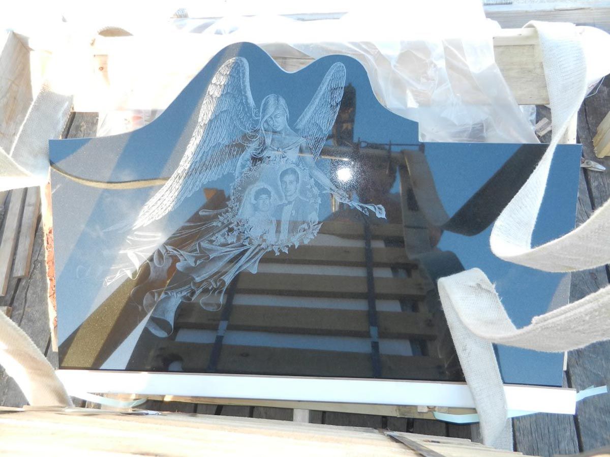 A piece of glass with a picture of a dragon on it