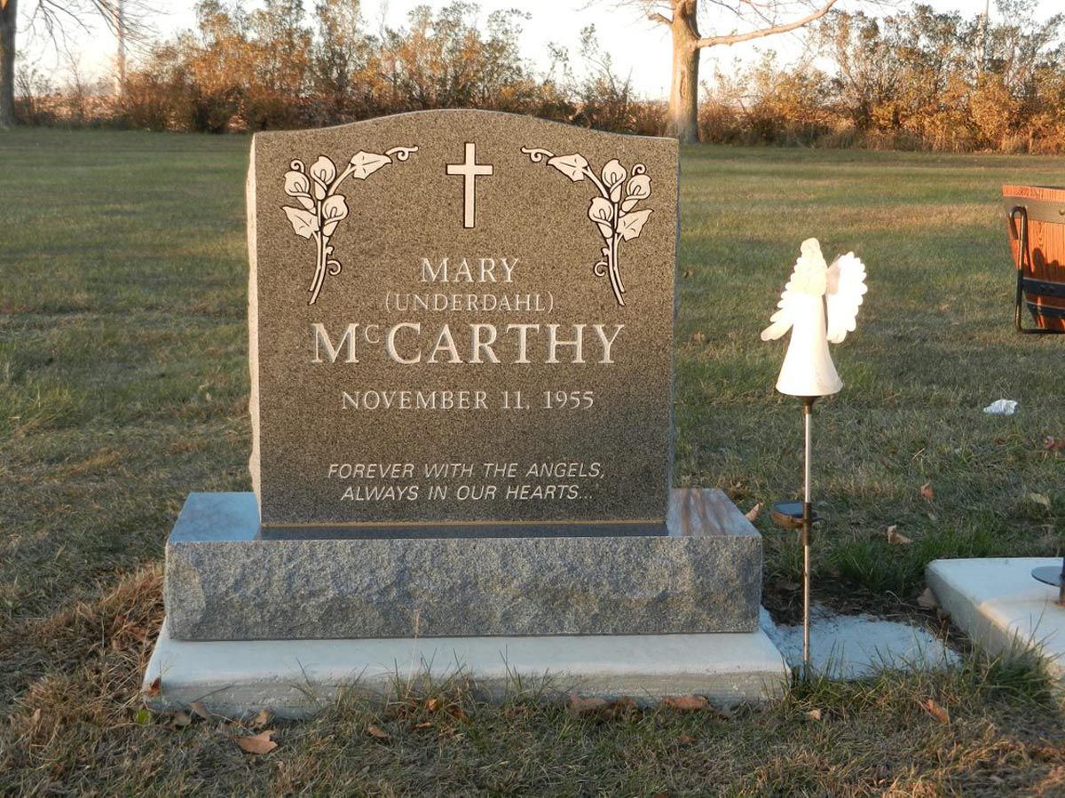 A gravestone for mary mccarthy is in a cemetery