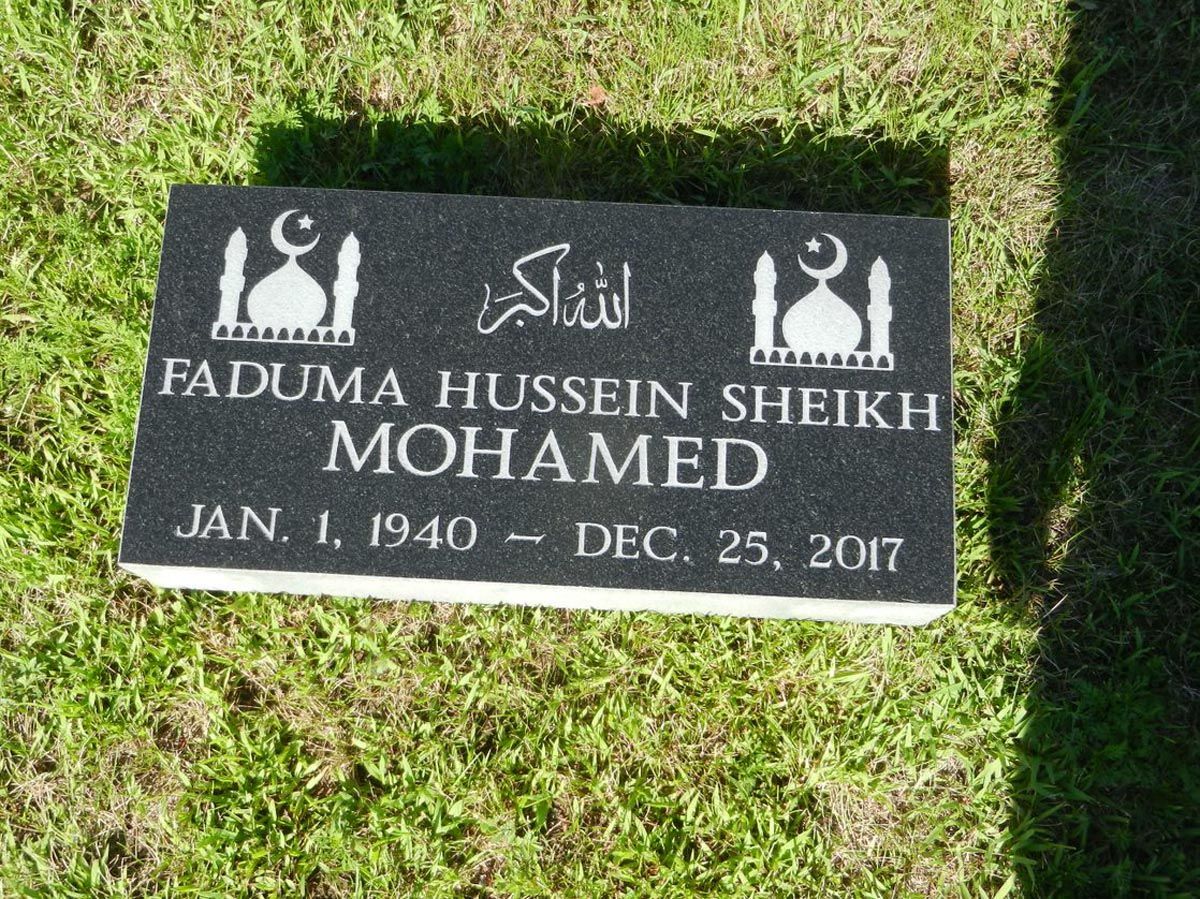 A gravestone for faduma hussein sheikh mohamed in a cemetery