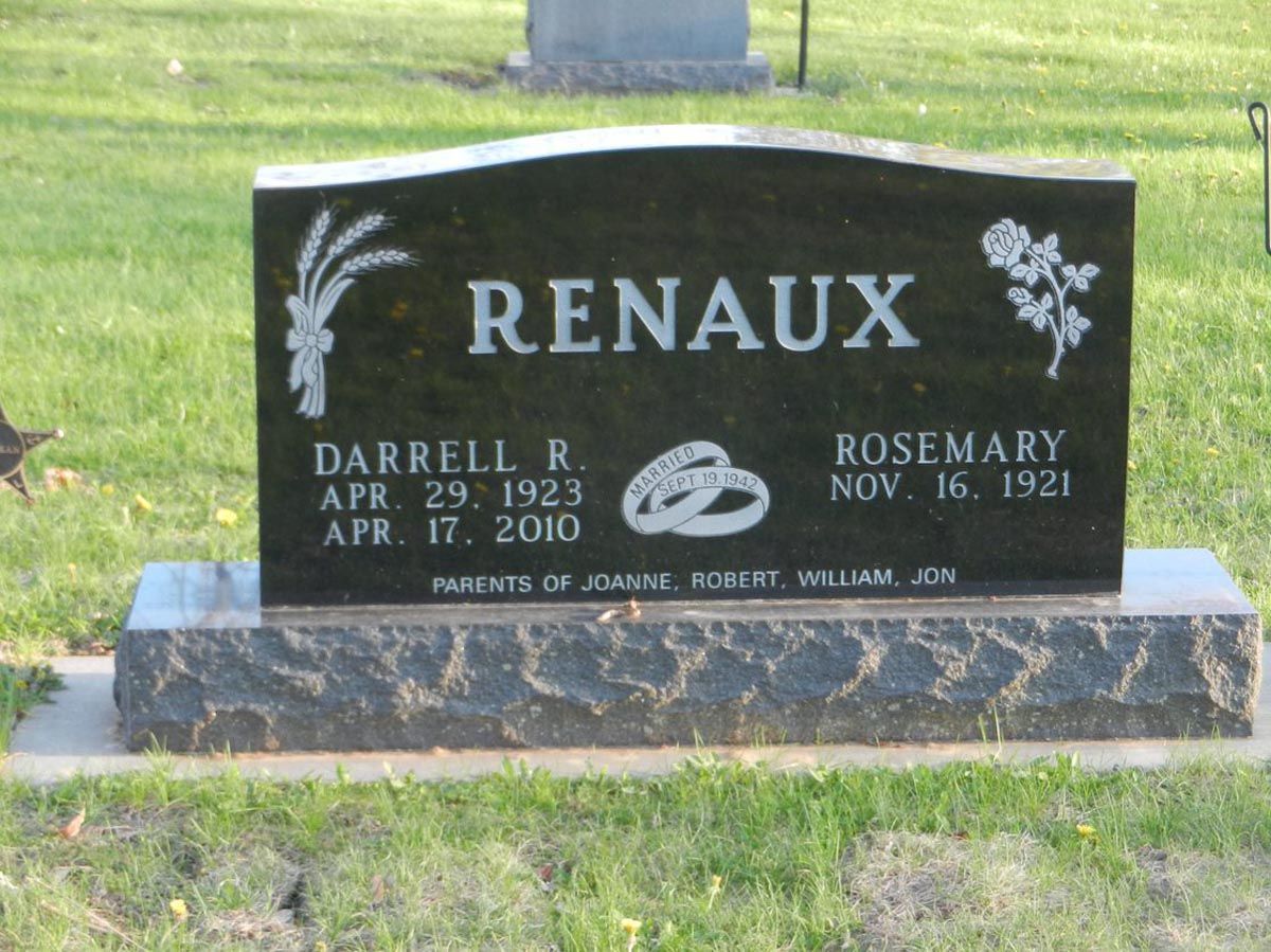 A black gravestone with the name renaud on it