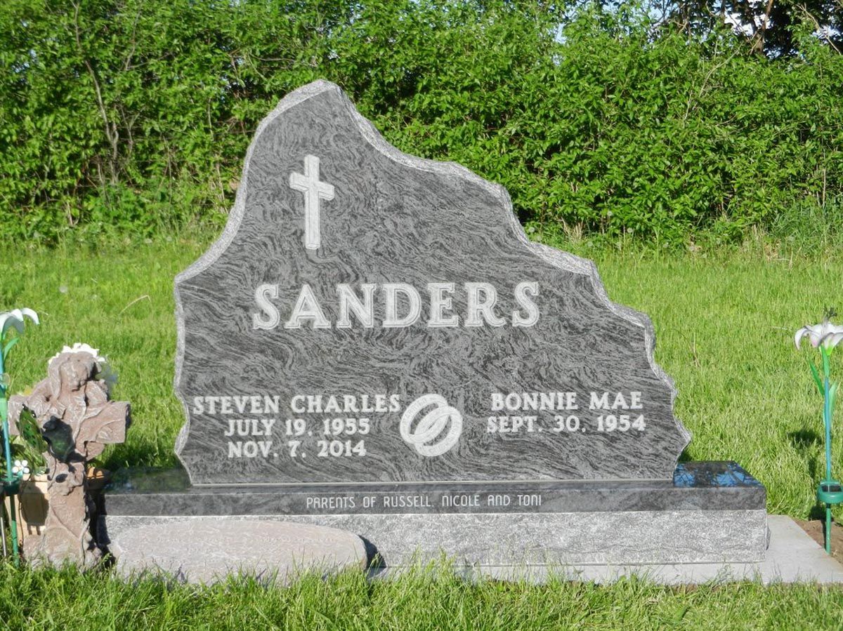 A gravestone for steven charles and bonnie mal sanders in a cemetery
