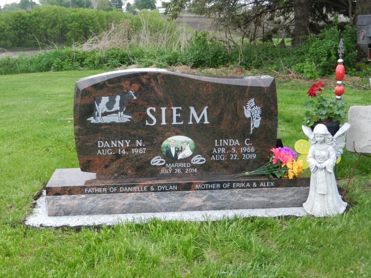 A gravestone for a couple named siem in a cemetery