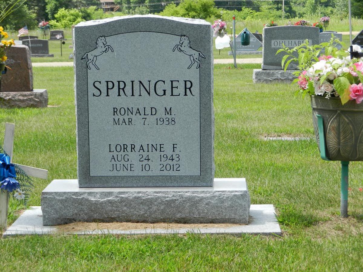 A gravestone in a cemetery with the name springer on it