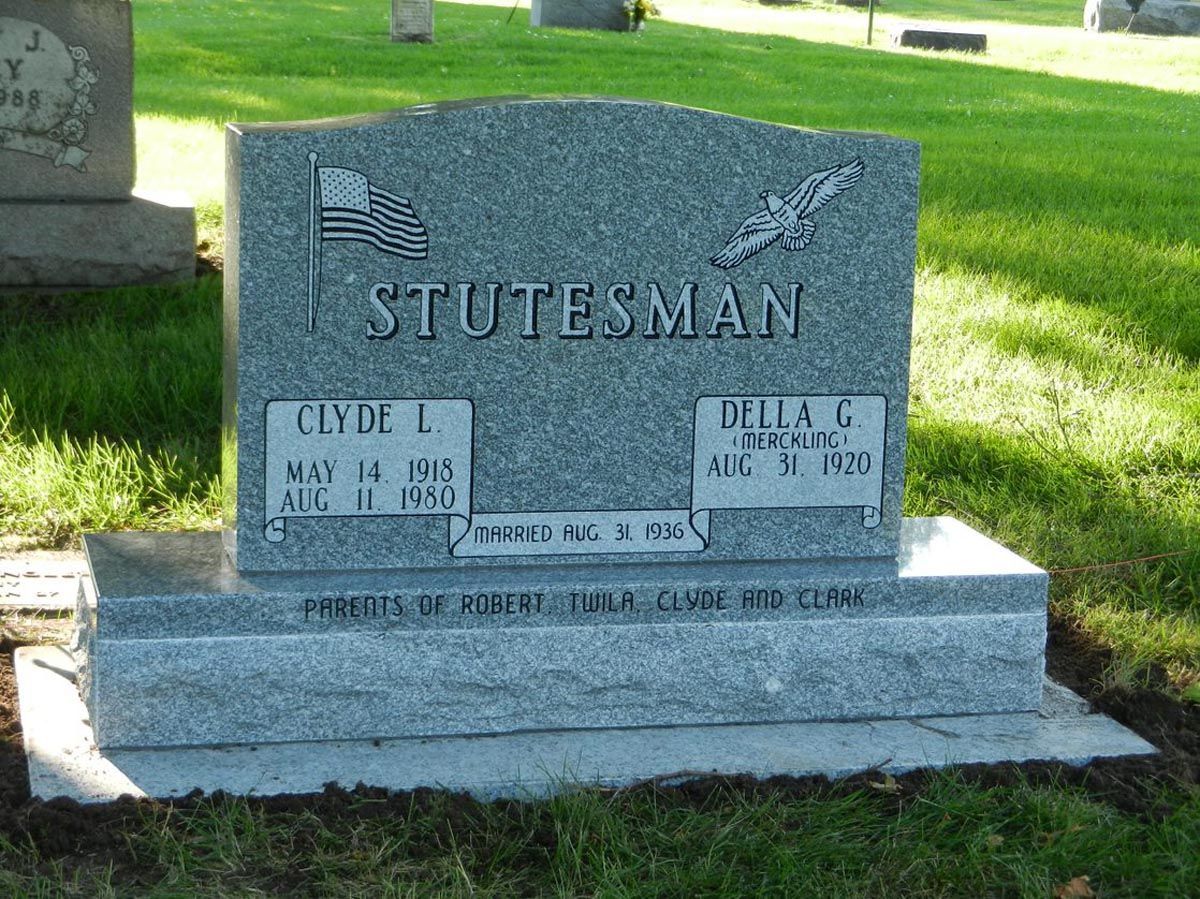 A gravestone in a cemetery with the name stutesman on it