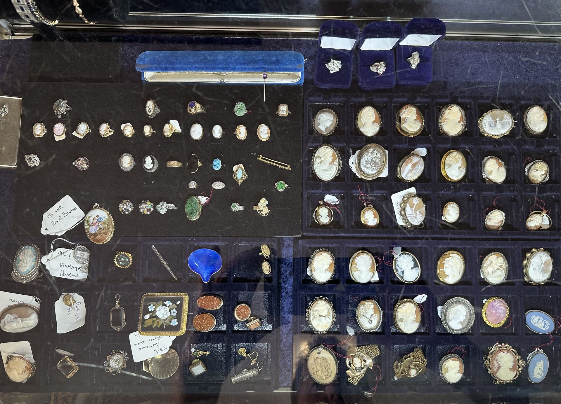 Two boxes filled with military medals and ribbons