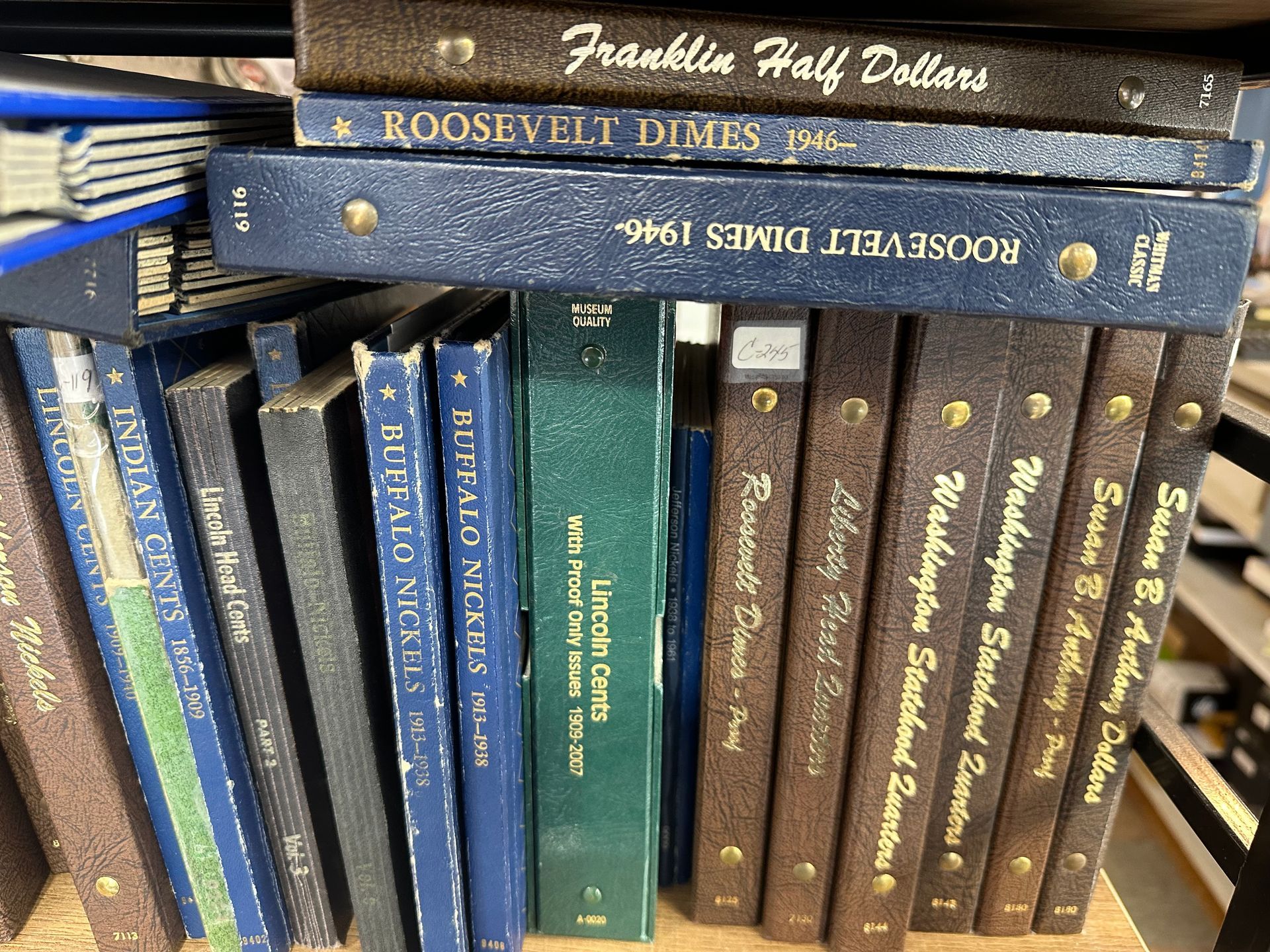 A glass display case filled with lots of watches