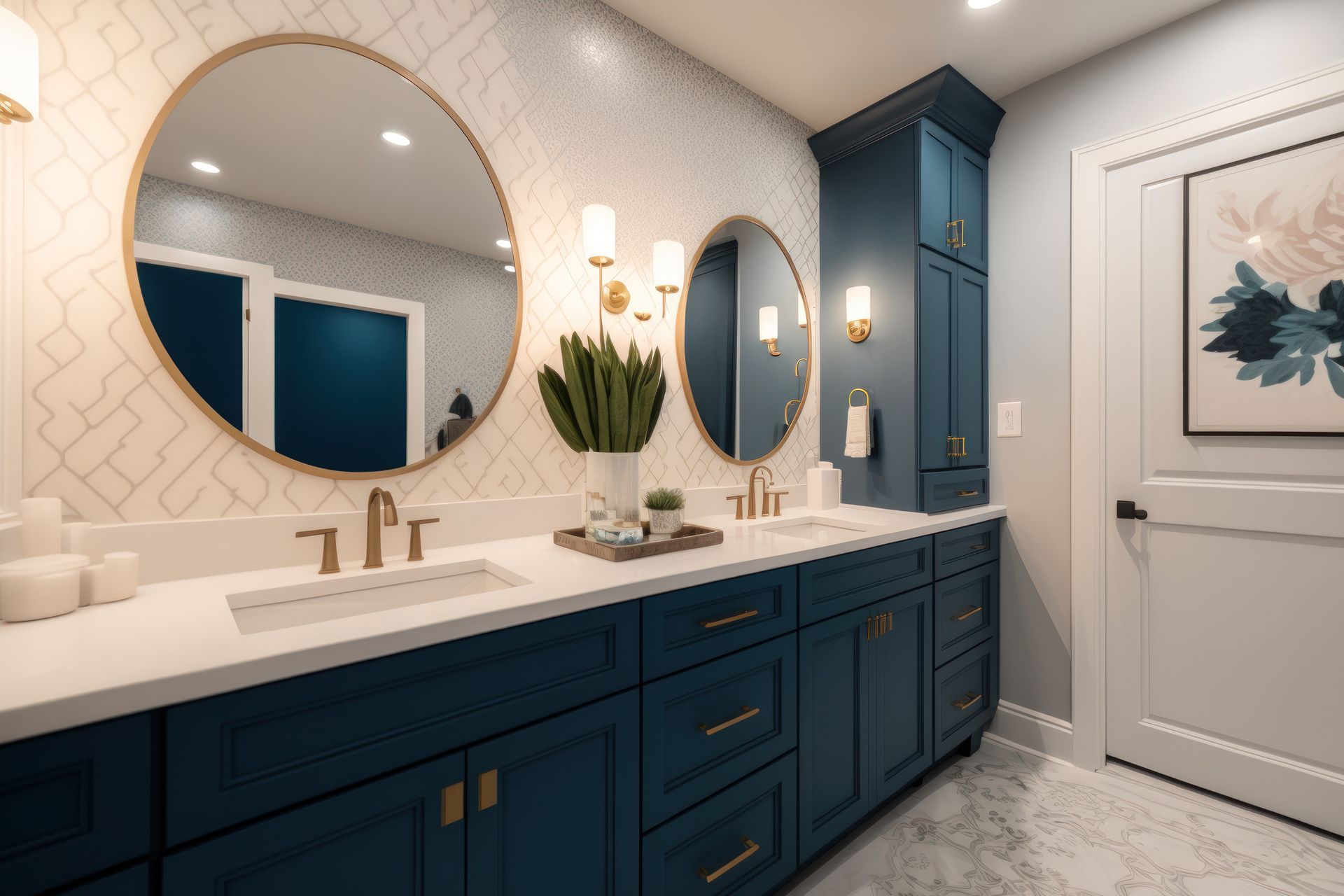 Blue bathroom with double sinks, gold accents, oval mirrors, and artwork on the wall.