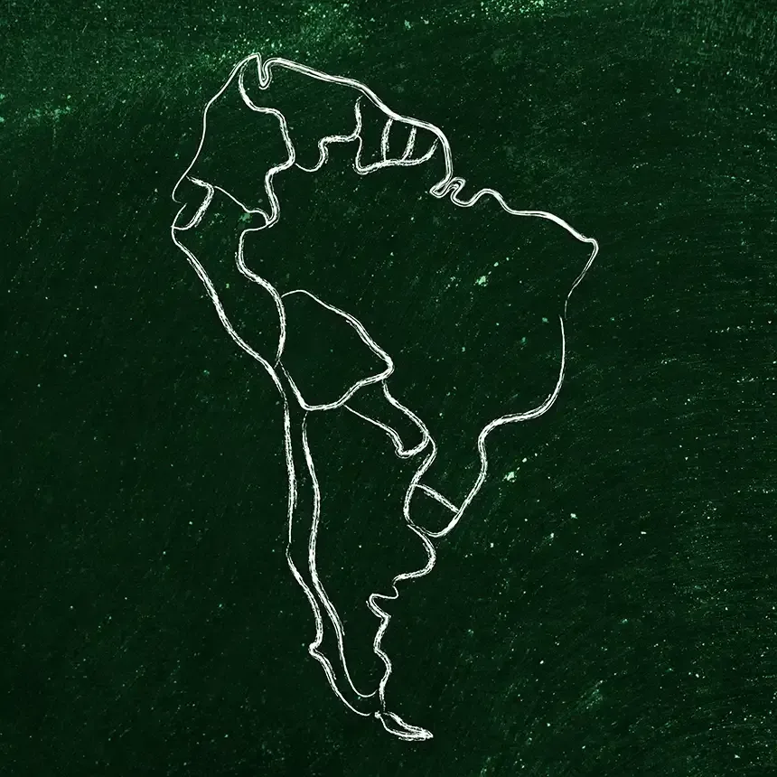 A chalk drawing of south america on a green background.