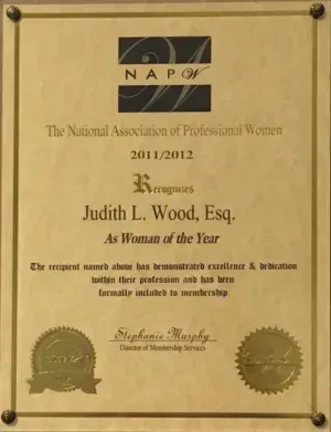 A certificate from the national association of professional women recognizes judith l. wood esq. as woman of the year.