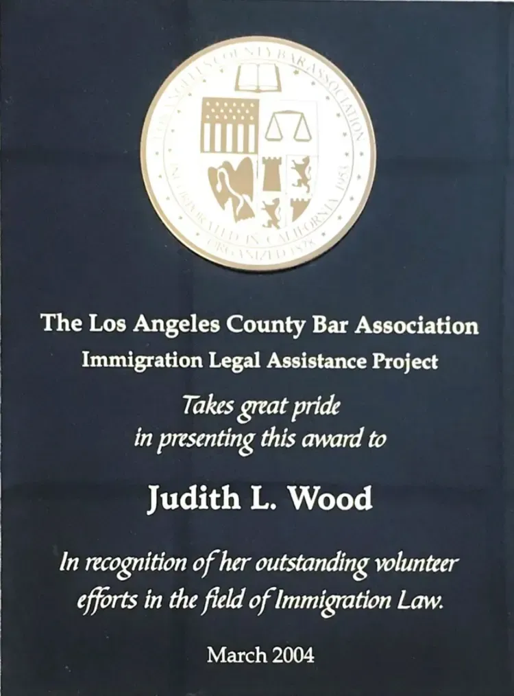 The los angeles county bar association immigration legal assistance project award given to judith l. wood.