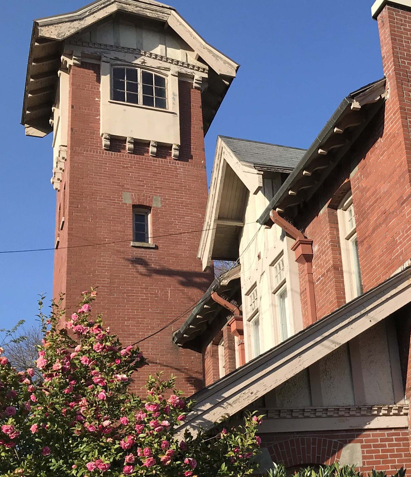 Picture of the brick tower of the Francis Street Firehouse, CMC's current location.