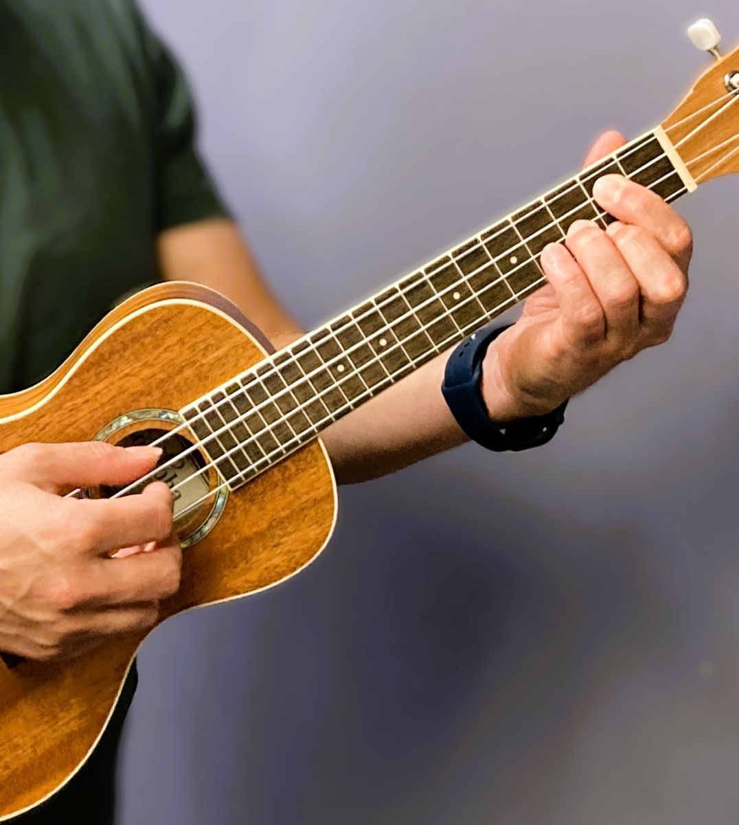 picture of an ukulele being played
