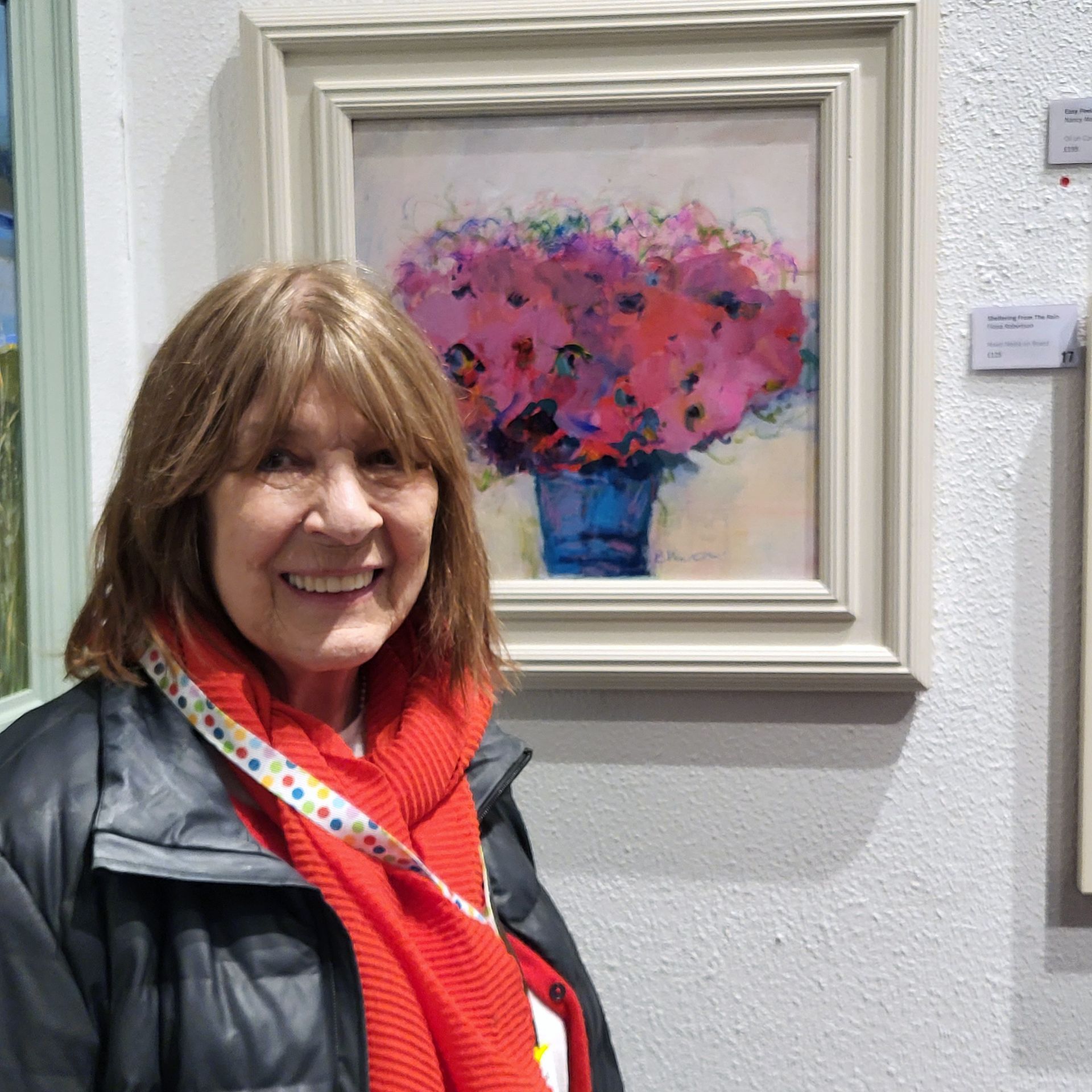 Artist Bridget Hunter next to her work