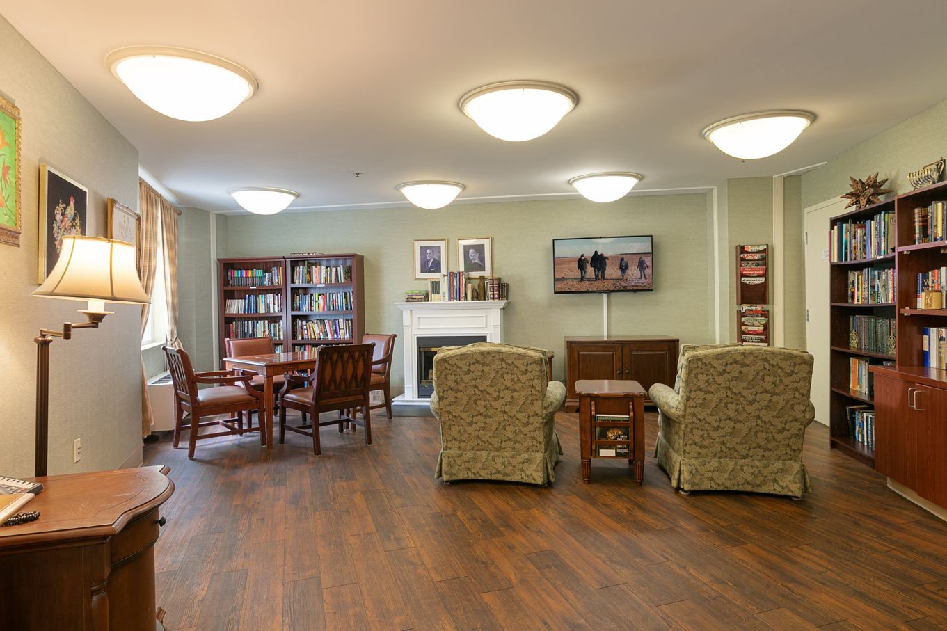 A living room filled with furniture and a fireplace.