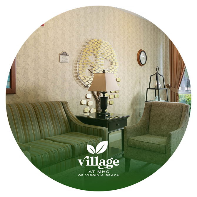 A living room with a couch and chairs and a lamp.