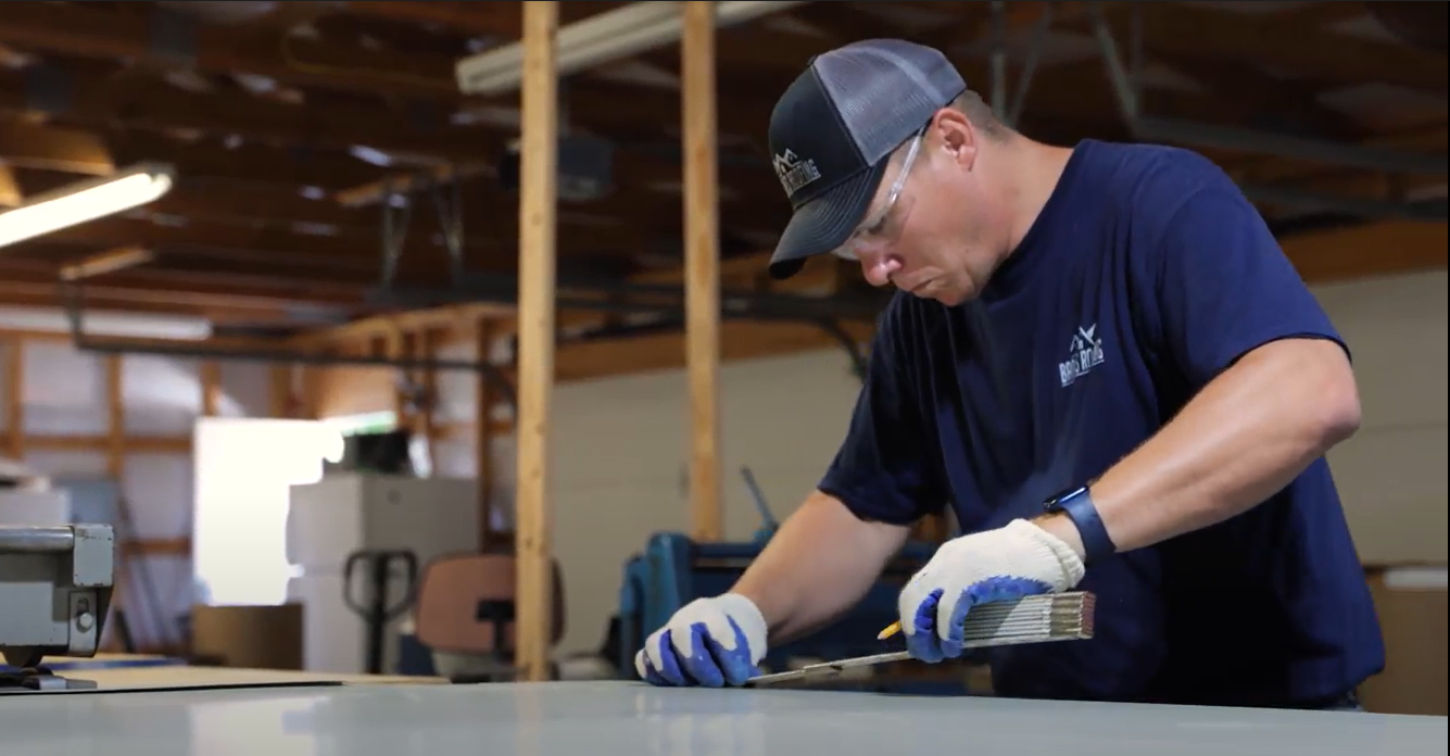 Worker Measuring Steel