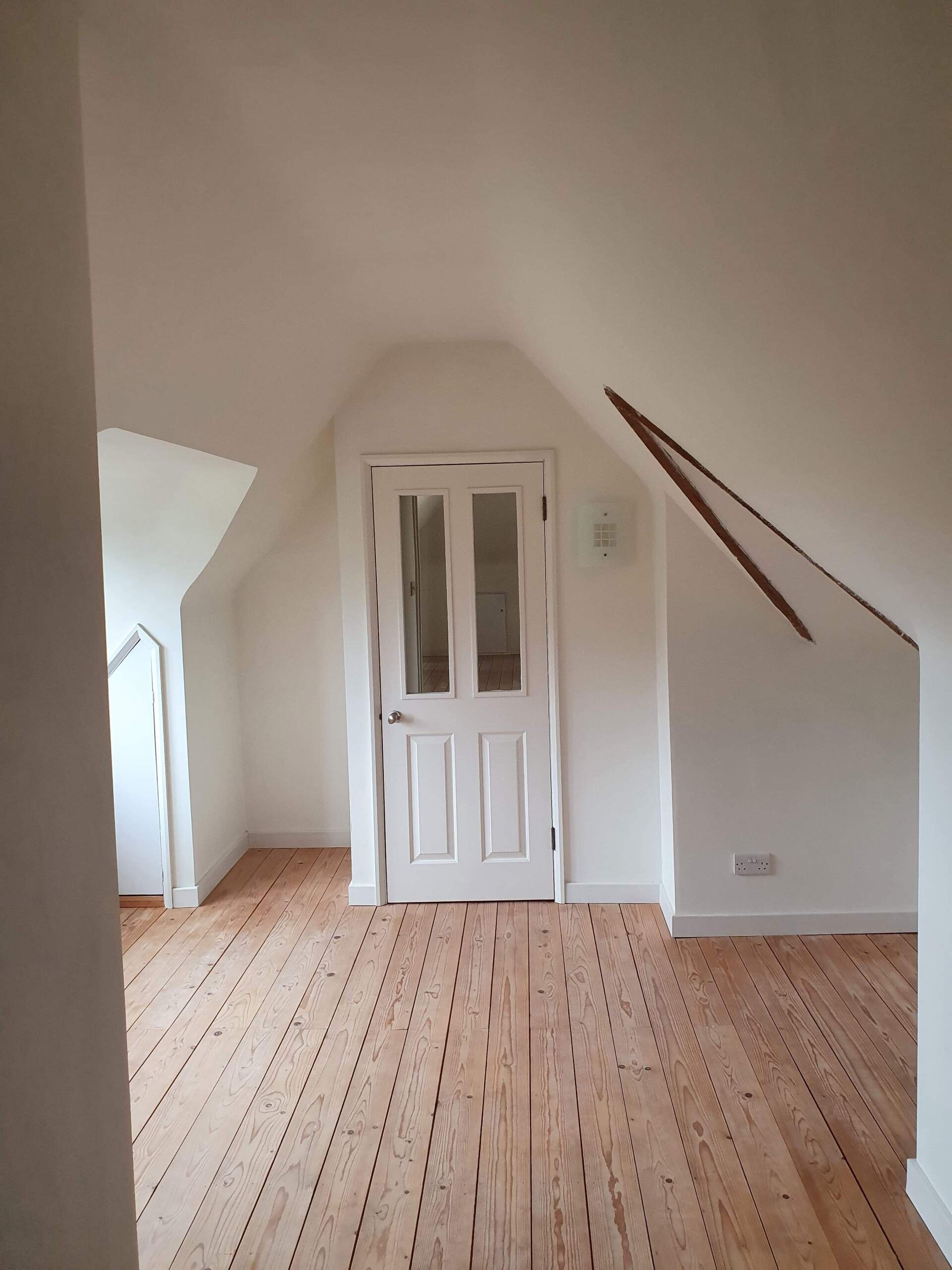 Picture of loft renovation painted white by painters and decorators Derby