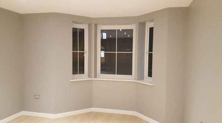 Picture of a living room painted in light grey by painters and decorators Derby