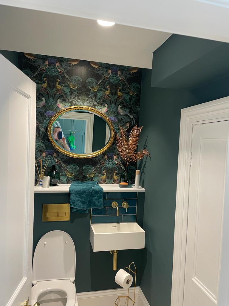 A [picture of a bathroom painted in deep green by painters and decorators Derby