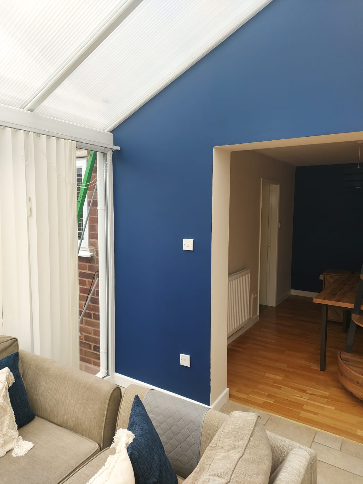 A picture of a conservatory repainted in blue and white by painters and decorators Derby