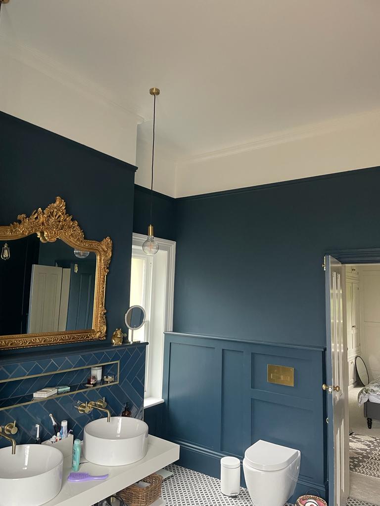 A picture of a room painted in deep blue with wood panelling by Painters and Decorators Derby