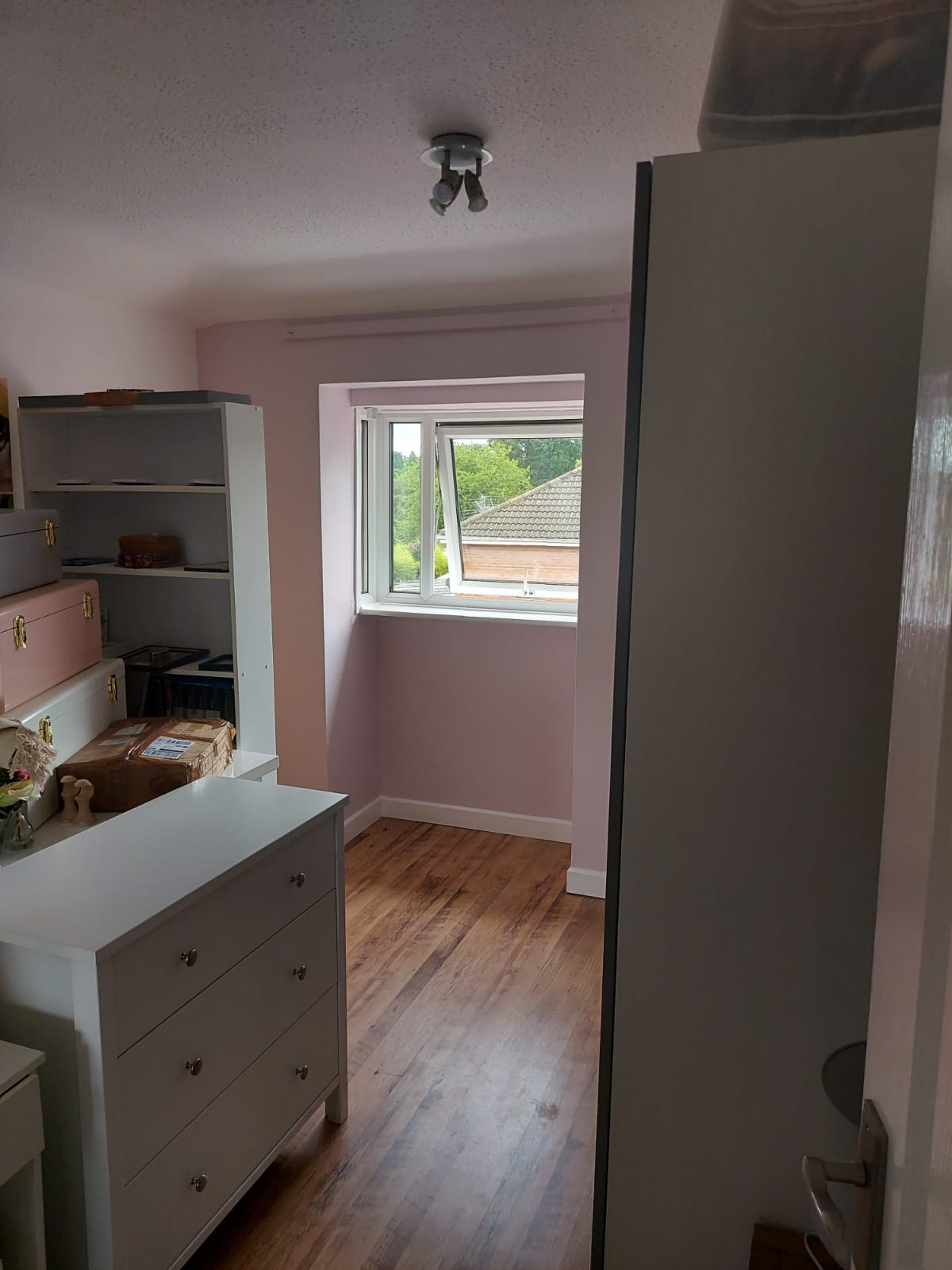 A picture of a bedroom painted in white by painters and decorators Derby