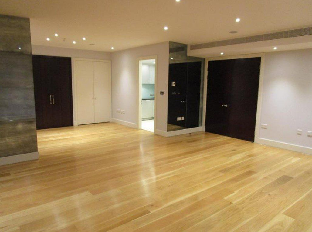 Picture of a master bedroom painted white with black doors by painters and decorators Derby