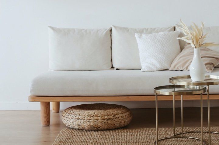 Picture of a living room with soft furnishings in a house which has been newly painted in white by Painters and Decorators Derby