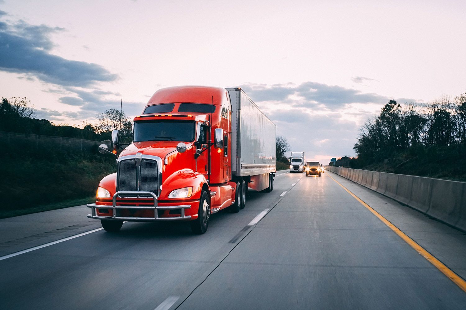 Bright red semi-truck on a highway Bright red semi-truck on a highway