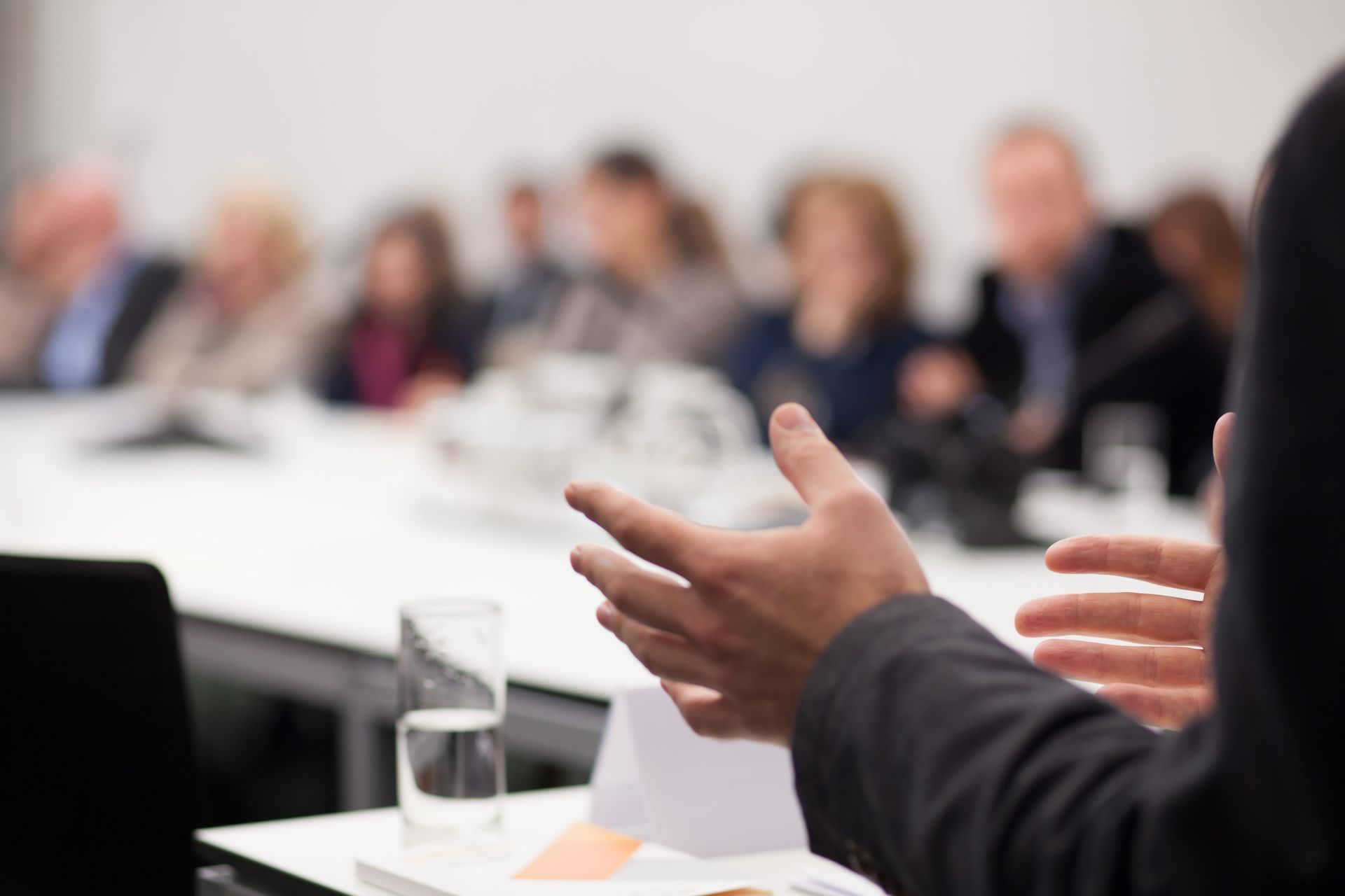 A man is giving a presentation in front of a group of people.