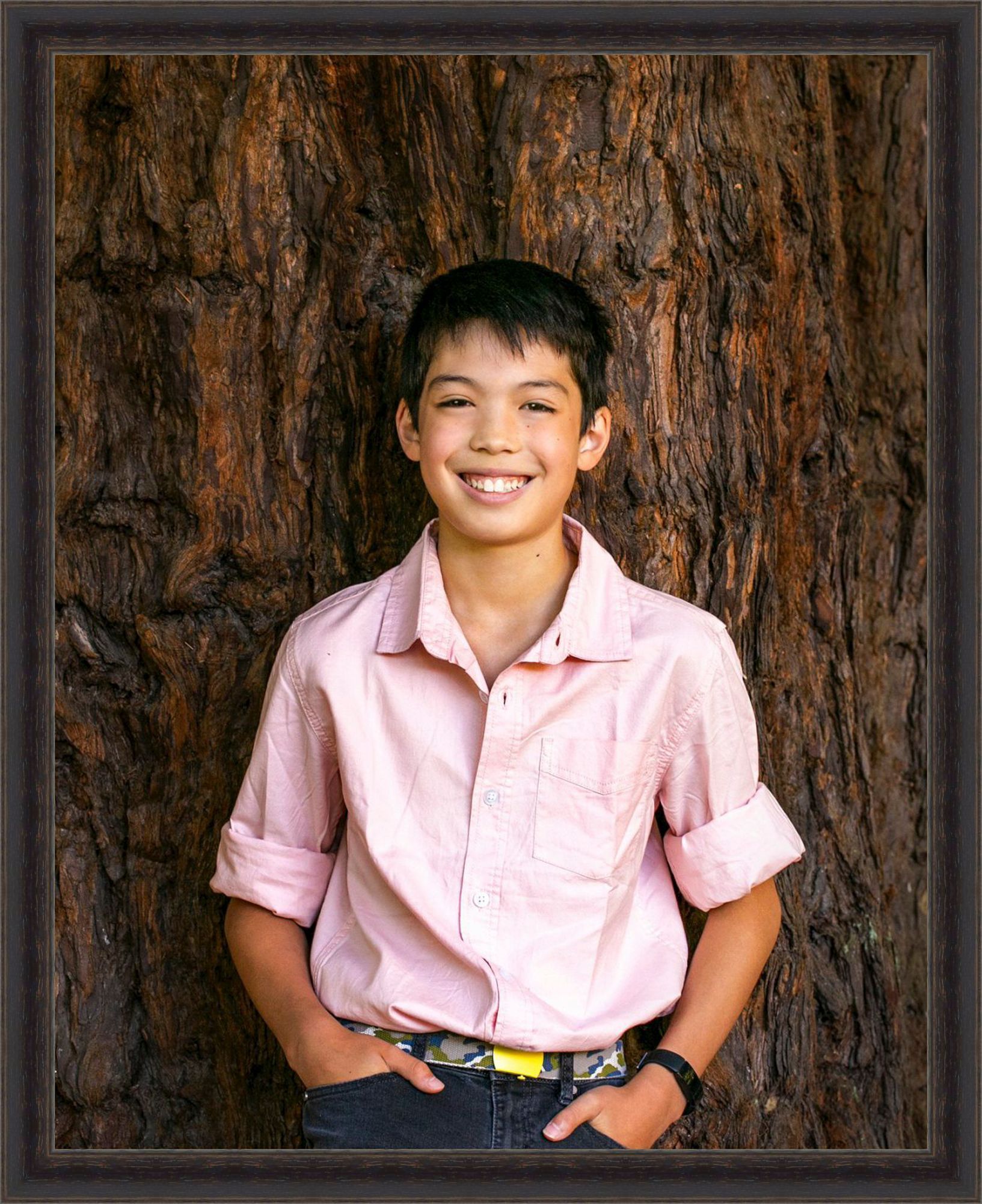 young son asian in park redwoods portrait