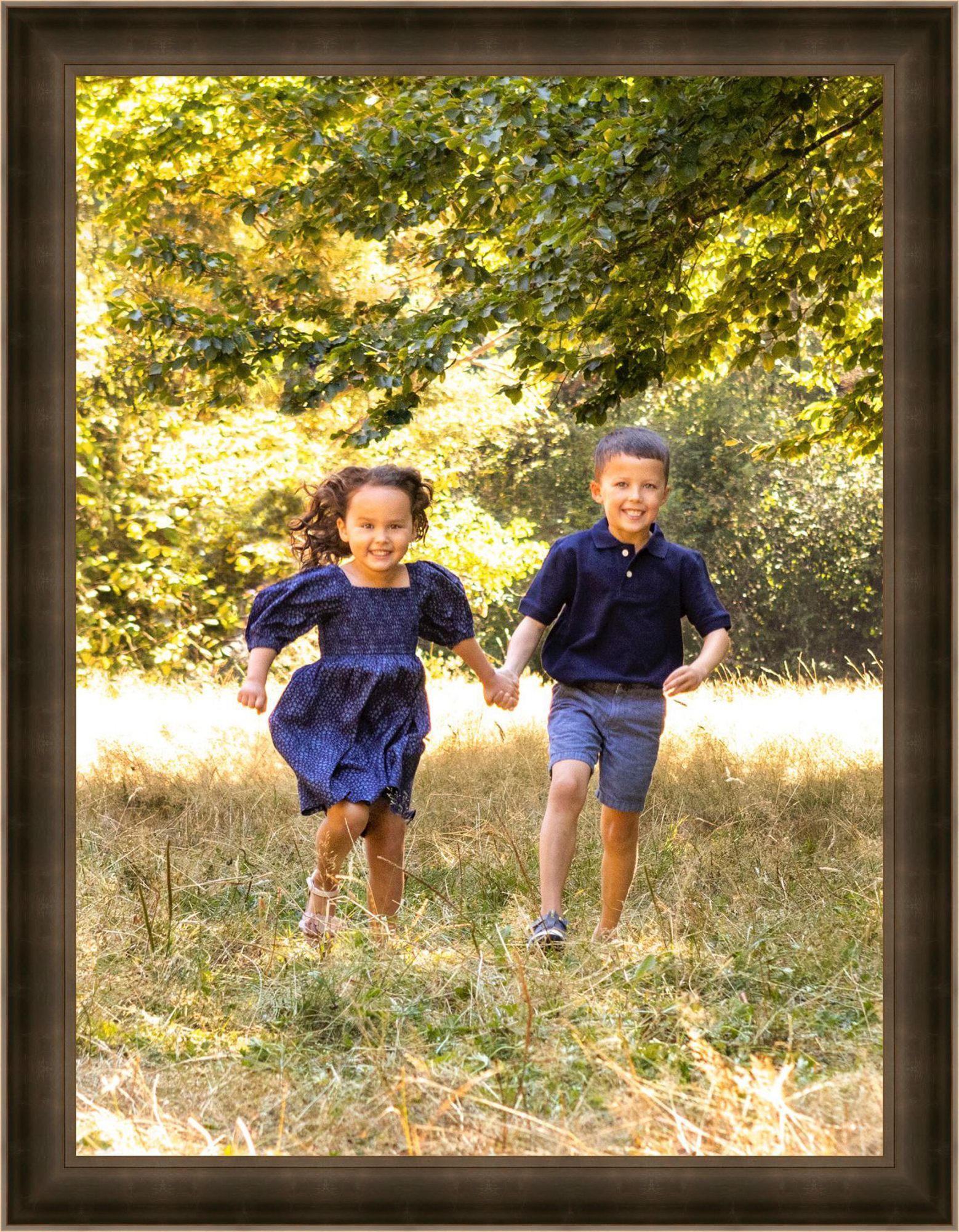 Kids running in the grass summertime fun