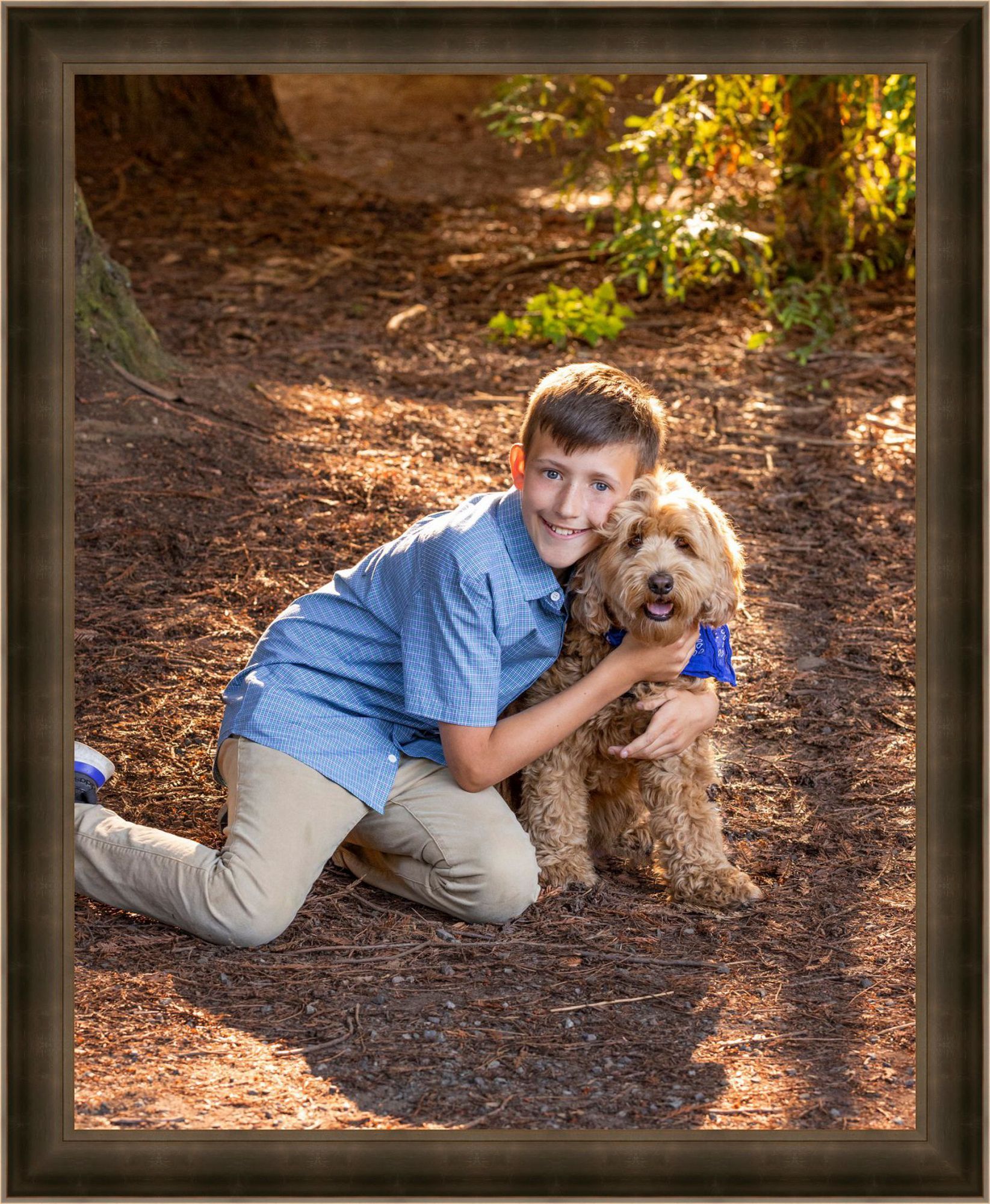 boy with his dog in the woods