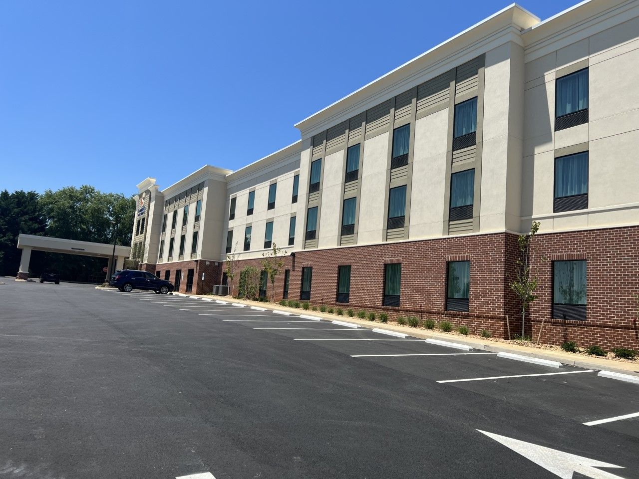 A large building with a parking lot in front of it