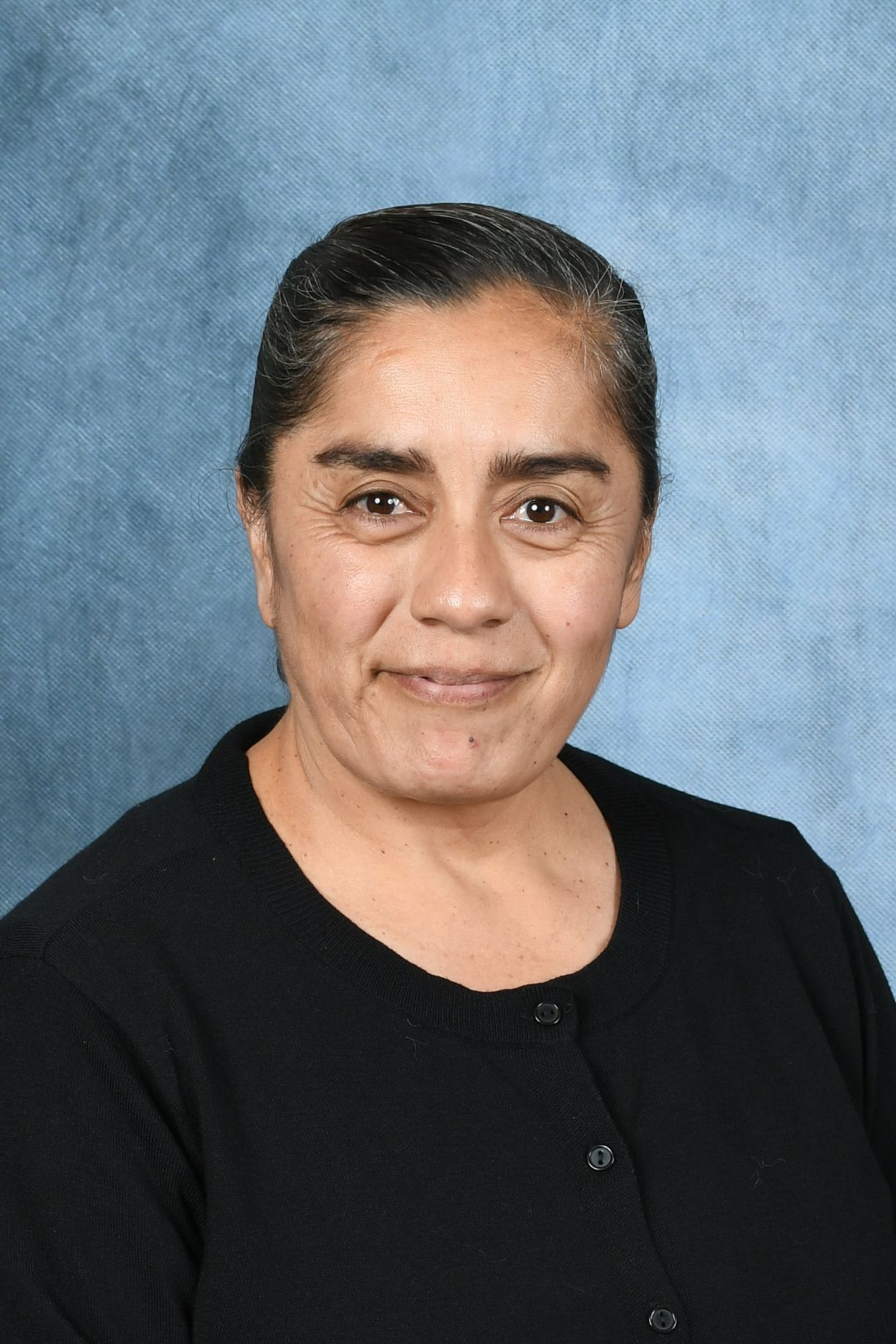 A woman wearing a black shirt that says hill lots preschool
