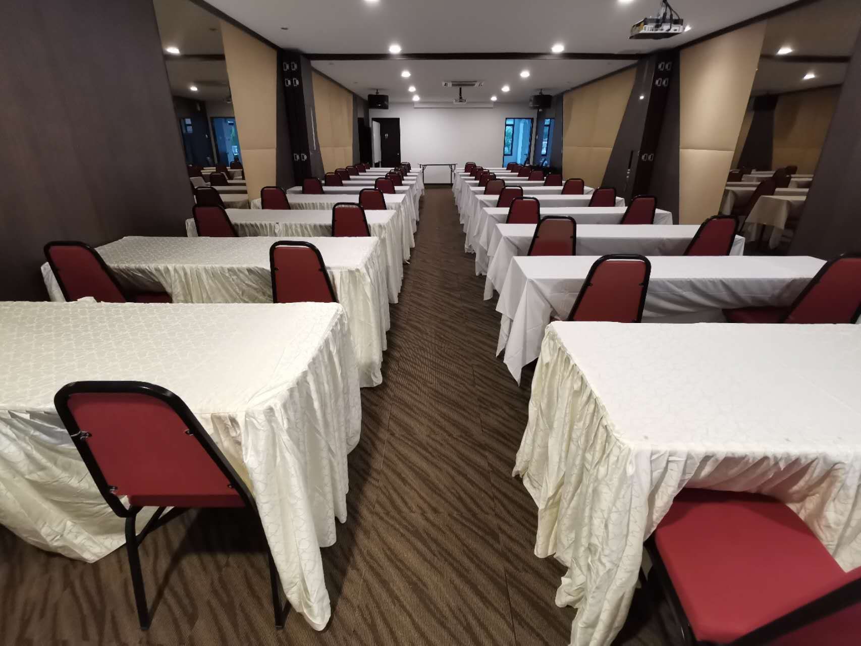 Rows of tables and chairs in a conference room