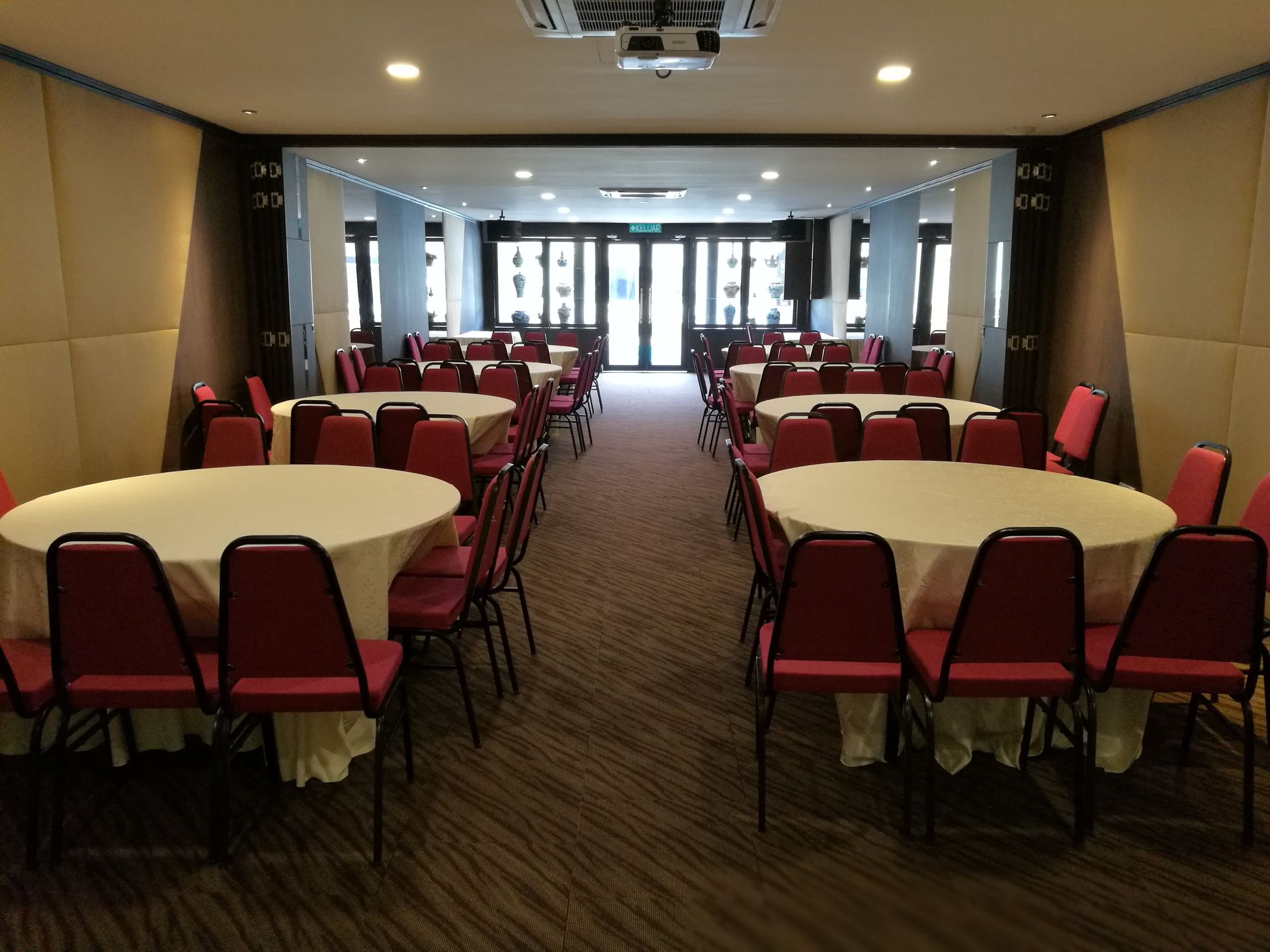 A large room with tables and chairs in it