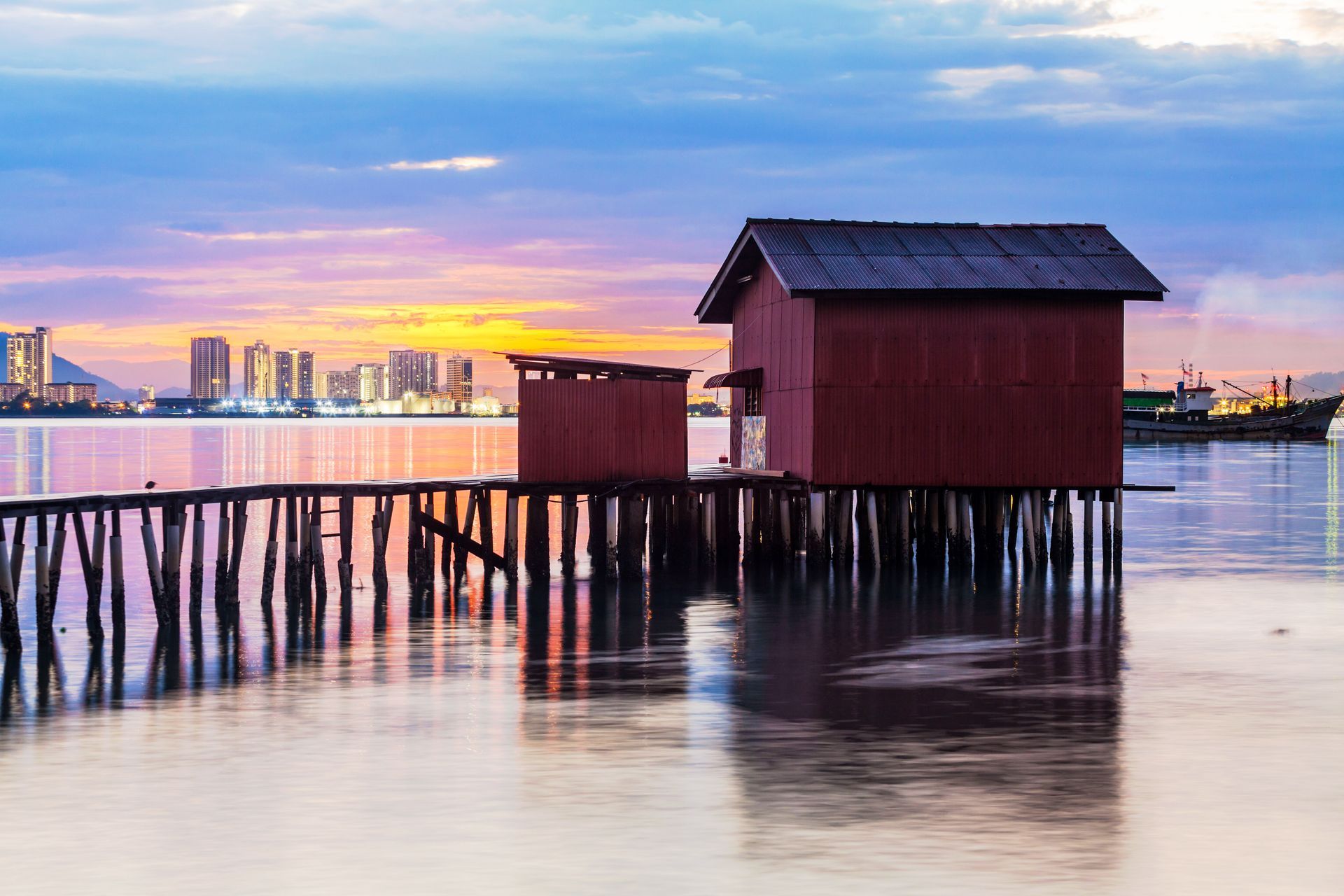 Image 42: A small house on stilts in the middle of a body of water.